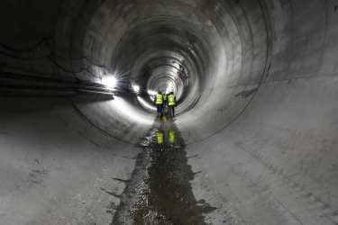 A picture of people walking inside the Waterway Protection Tunnel