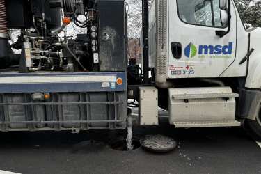 An MSD water truck flushing a pipe 