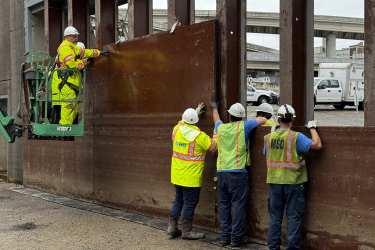 A floodwall closure being build by an MSD crew.